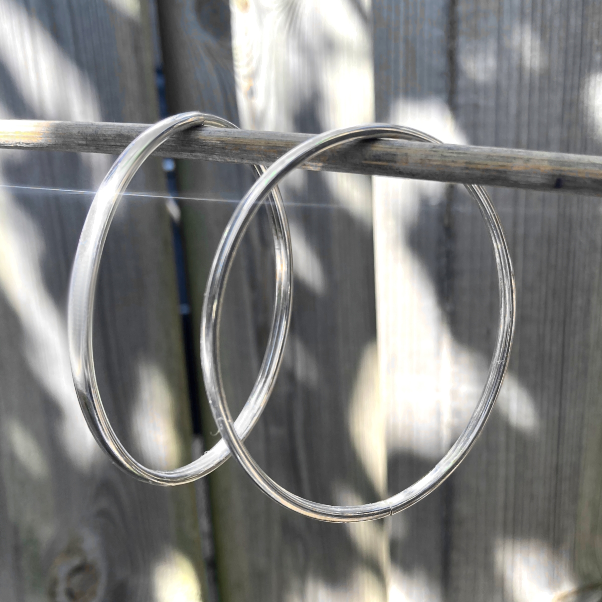 Zilveren bangles dop sfeer
